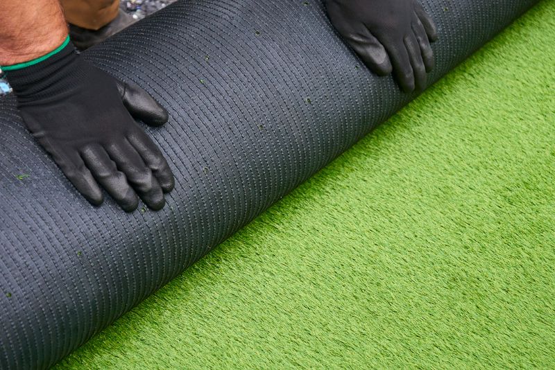 rolling up artificial grass