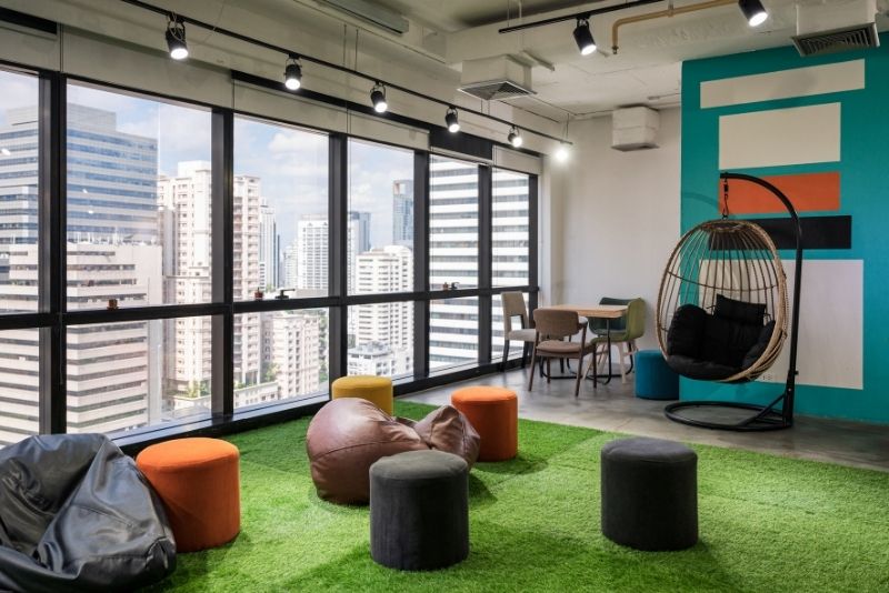 an entertainment space with artificial grass indoors