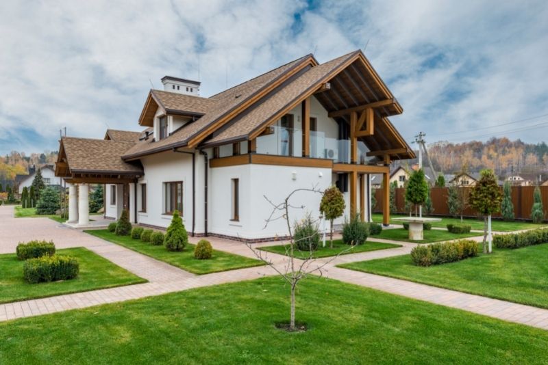 a residential home with artificial lawn